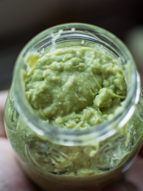 Guacamole in a glass jar