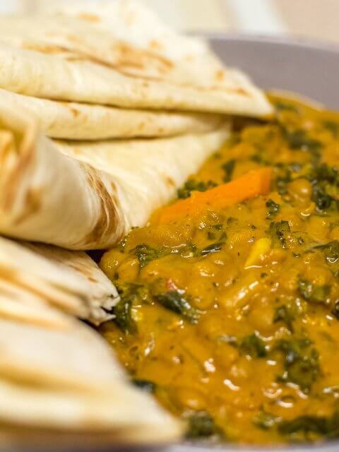 lentil and kale curry with flour tortilla