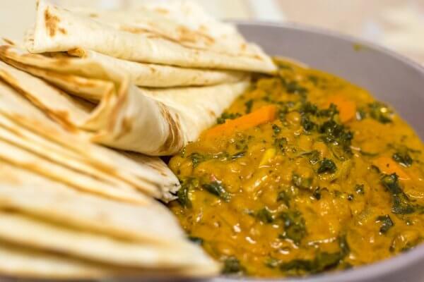 lentil and kale curry with flour tortilla